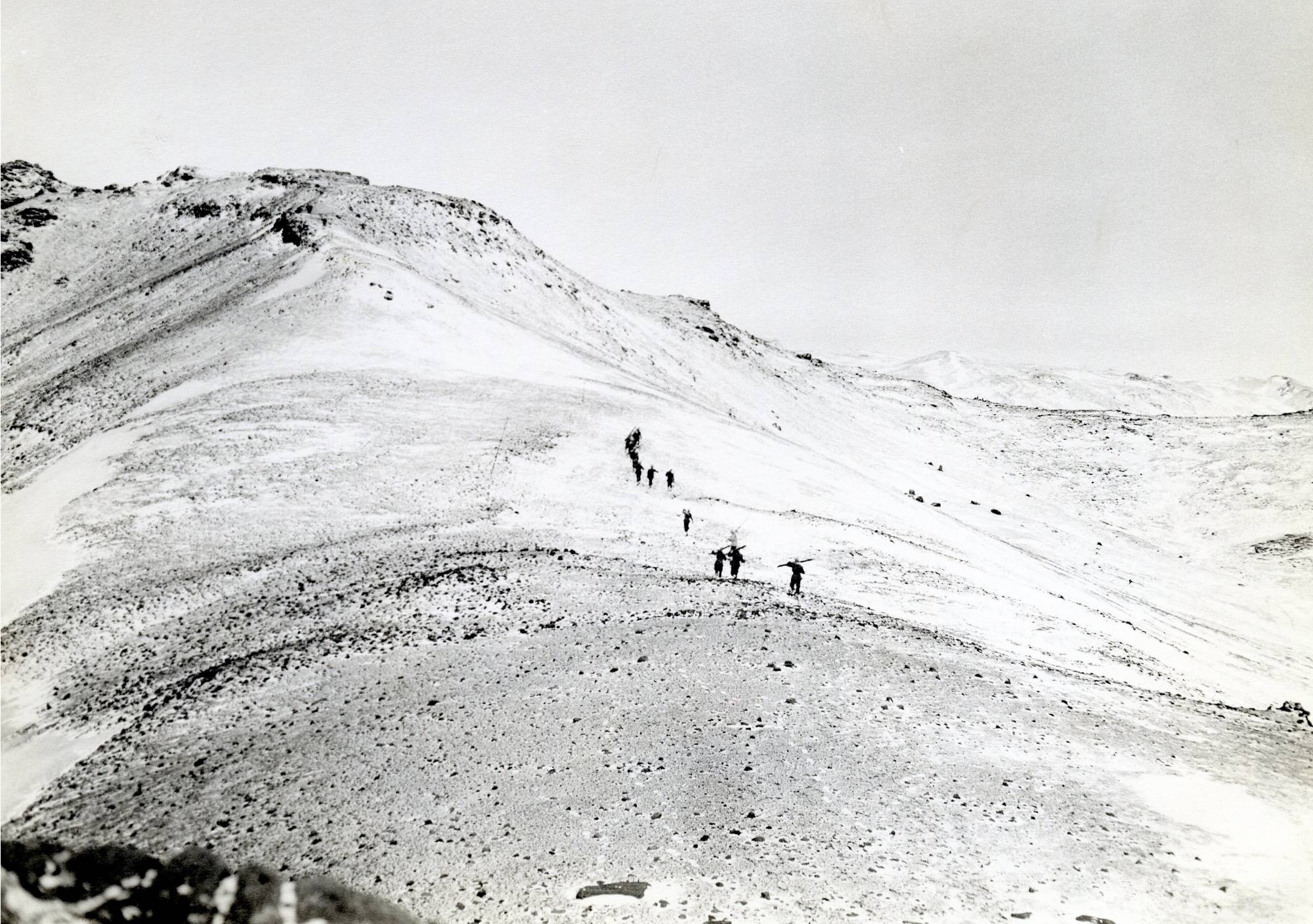 Iceland Mountains with troops martching across